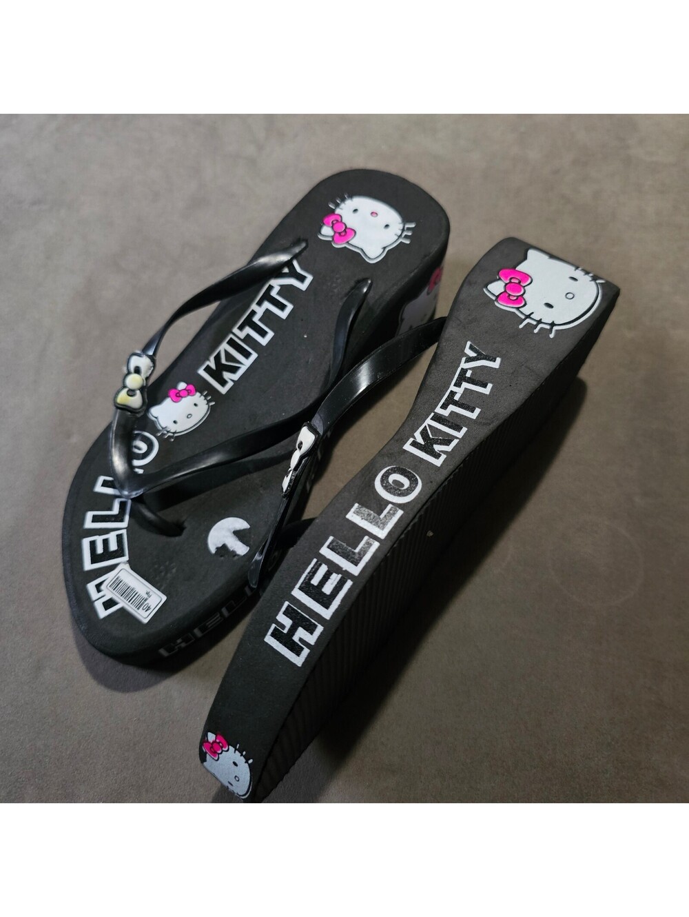 Women's black wedge flip flops